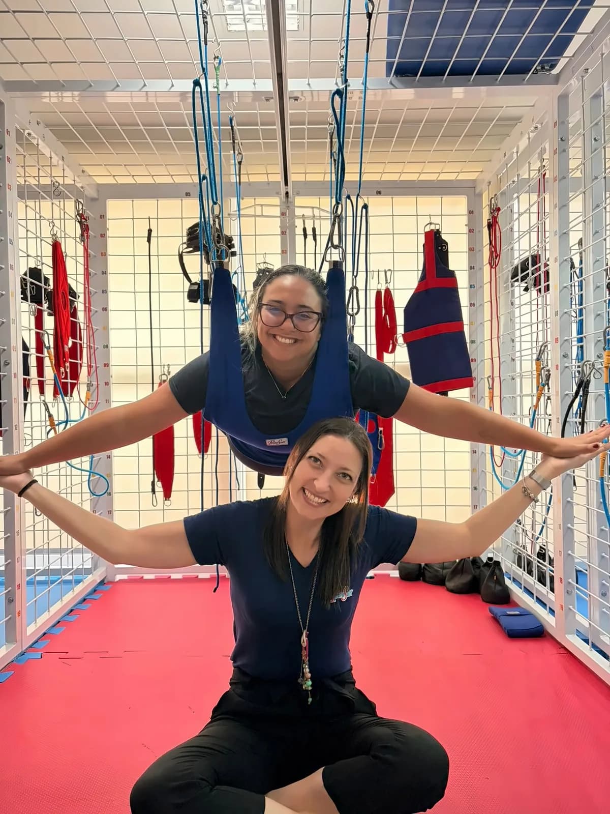 Two therapists practicing together inside the Spider Cage